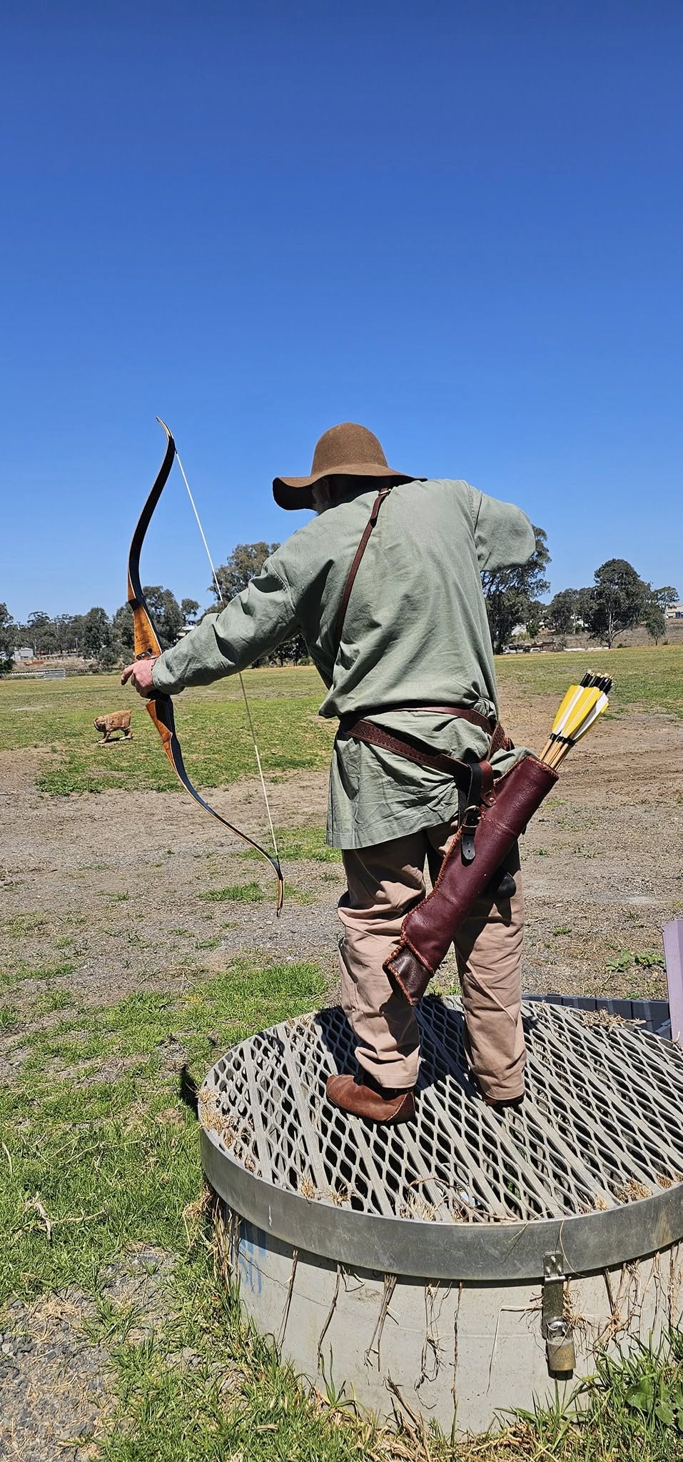 Archer at full draw