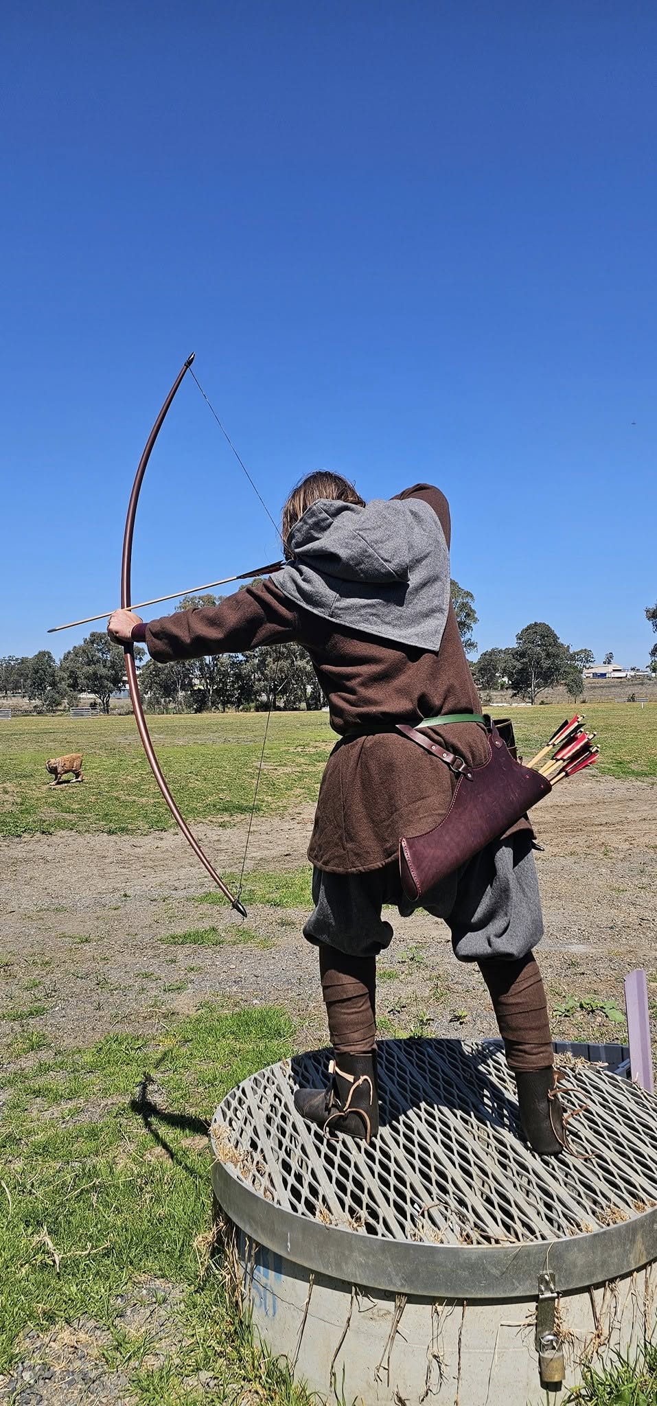 Archer taking aim at target