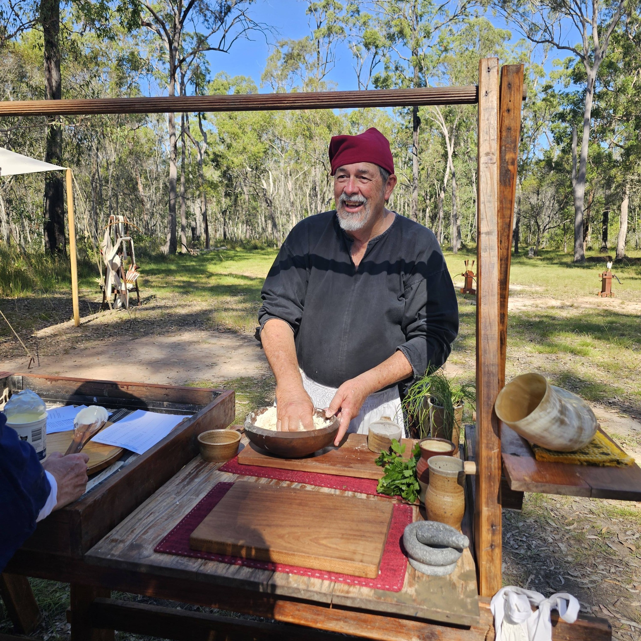 Member cooking in camp